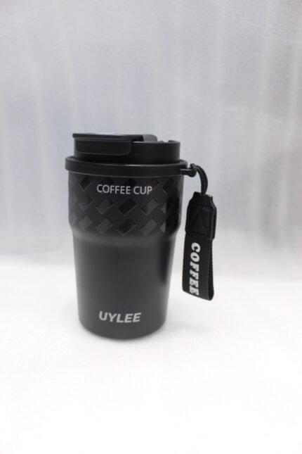 Four 350ml LYLEE insulated travel coffee mugs in taupe, white, olive green, and matte black lined up on a marble countertop.