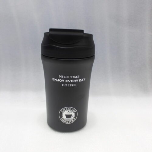 Four 450ml insulated travel coffee mugs in navy blue, olive green, cream, and matte black on a marble kitchen countertop