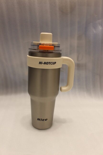 Two HI-HOTCUP 1250ml stainless steel insulated tumblers with handles in silver-cream and matte black on a kitchen counter.