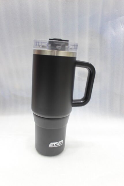 Four 1180ml insulated stainless steel tumblers with handles and clear lids in pink, cream, black, and burgundy lined up on a kitchen counter.