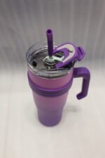 Five 1180ml ombre stainless steel tumblers with handles and straws in blue, green, purple, black, and pink lined up on a marble kitchen counter.