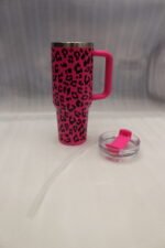 Six 1180ml leopard print insulated travel tumblers with handles and straws displayed in various colors on a kitchen counter.
