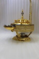 Luxury gold buffet chafing dish with overhead hanging dome lid, stainless steel food pan, and attached serving tongs.