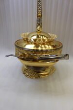 Luxury gold buffet chafing dish with overhead hanging dome lid, stainless steel food pan, and attached serving tongs.
