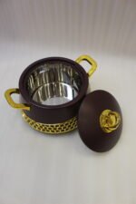 Set of three deep maroon insulated hot pots with gold handles and honeycomb gold accent trim on a kitchen counter.