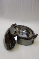 One More 3-piece gunmetal stainless steel insulated hot pot set with wood-grain handles on a wooden table.