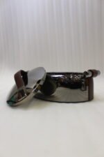 One More 3-piece gunmetal stainless steel insulated hot pot set with wood-grain handles on a wooden table.