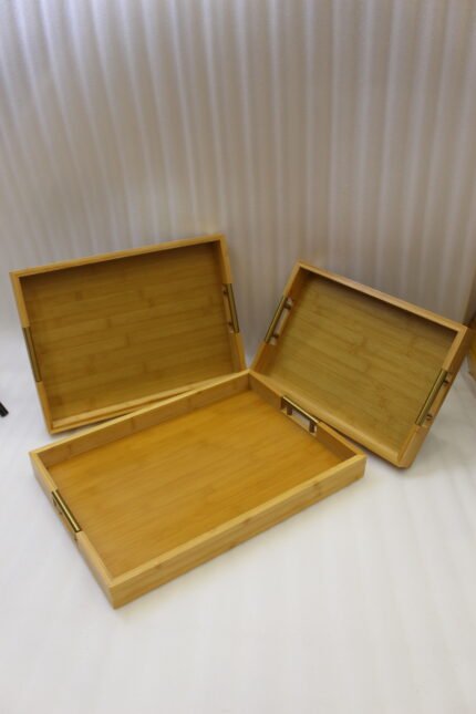 ONEMORE 3 piece natural wooden serving tray set with metallic brass handles resting on a kitchen countertop