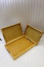 ONEMORE 3 piece natural wooden serving tray set with metallic brass handles resting on a kitchen countertop