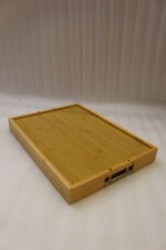 ONEMORE 3 piece natural wooden serving tray set with metallic brass handles resting on a kitchen countertop