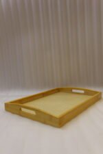 3 piece natural wooden serving tray set with woven cane rattan mesh bottom and side handles on a kitchen countertop