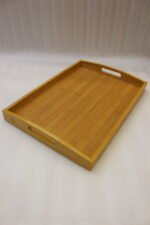 3 piece rectangular wooden serving tray set with built-in cutout handles displayed on a marble kitchen countertop