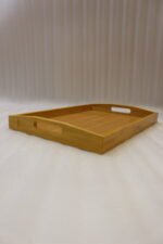3 piece rectangular wooden serving tray set with built-in cutout handles displayed on a marble kitchen countertop