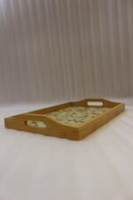 3 piece wooden serving tray set with floral printed base and built in handles on a kitchen countertop