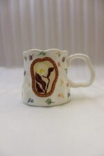 Handcrafted cream ceramic coffee mug featuring hand-painted botanical flower artwork, a scalloped rim, and an ergonomic wavy handle sitting on a marble countertop.Handcrafted cream ceramic coffee mug featuring hand-painted botanical flower artwork, a scalloped rim, and an ergonomic wavy handle sitting on a marble countertop.Handcrafted cream ceramic coffee mug featuring hand-painted botanical flower artwork, a scalloped rim, and an ergonomic wavy handle sitting on a marble countertop.Handcrafted cream ceramic coffee mug featuring hand-painted botanical flower artwork, a scalloped rim, and an ergonomic wavy handle sitting on a marble countertop.Handcrafted cream ceramic coffee mug featuring hand-painted botanical flower artwork, a scalloped rim, and an ergonomic wavy handle sitting on a marble countertop.Handcrafted cream ceramic coffee mug featuring hand-painted botanical flower artwork, a scalloped rim, and an ergonomic wavy handle sitting on a marble countertop.Handcrafted cream ceramic coffee mug featuring hand-painted botanical flower artwork, a scalloped rim, and an ergonomic wavy handle sitting on a marble countertop.Handcrafted cream ceramic coffee mug featuring hand-painted botanical flower artwork, a scalloped rim, and an ergonomic wavy handle sitting on a marble countertop.Handcrafted cream ceramic coffee mug featuring hand-painted botanical flower artwork, a scalloped rim, and an ergonomic wavy handle sitting on a marble countertop.Handcrafted cream ceramic coffee mug featuring hand-painted botanical flower artwork, a scalloped rim, and an ergonomic wavy handle sitting on a marble countertop.Handcrafted cream ceramic coffee mug featuring hand-painted botanical flower artwork, a scalloped rim, and an ergonomic wavy handle sitting on a marble countertop.Handcrafted cream ceramic coffee mug featuring hand-painted botanical flower artwork, a scalloped rim, and an ergonomic wavy handle sitting on a marble countertop.Handcrafted cream ceramic coffee mug featuring hand-painted botanical flower artwork, a scalloped rim, and an ergonomic wavy handle sitting on a marble countertop.Handcrafted cream ceramic coffee mug featuring hand-painted botanical flower artwork, a scalloped rim, and an ergonomic wavy handle sitting on a marble countertop.Handcrafted cream ceramic coffee mug featuring hand-painted botanical flower artwork, a scalloped rim, and an ergonomic wavy handle sitting on a marble countertop.Handcrafted cream ceramic coffee mug featuring hand-painted botanical flower artwork, a scalloped rim, and an ergonomic wavy handle sitting on a marble countertop.Handcrafted cream ceramic coffee mug featuring hand-painted botanical flower artwork, a scalloped rim, and an ergonomic wavy handle sitting on a marble countertop.Handcrafted cream ceramic coffee mug featuring hand-painted botanical flower artwork, a scalloped rim, and an ergonomic wavy handle sitting on a marble countertop.Handcrafted cream ceramic coffee mug featuring hand-painted botanical flower artwork, a scalloped rim, and an ergonomic wavy handle sitting on a marble countertop.Handcrafted cream ceramic coffee mug featuring hand-painted botanical flower artwork, a scalloped rim, and an ergonomic wavy handle sitting on a marble countertop.Handcrafted cream ceramic coffee mug featuring hand-painted botanical flower artwork, a scalloped rim, and an ergonomic wavy handle sitting on a marble countertop.Handcrafted cream ceramic coffee mug featuring hand-painted botanical flower artwork, a scalloped rim, and an ergonomic wavy handle sitting on a marble countertop.Handcrafted cream ceramic coffee mug featuring hand-painted botanical flower artwork, a scalloped rim, and an ergonomic wavy handle sitting on a marble countertop.Handcrafted cream ceramic coffee mug featuring hand-painted botanical flower artwork, a scalloped rim, and an ergonomic wavy handle sitting on a marble countertop.