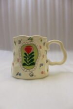 Handcrafted cream ceramic coffee mug featuring hand-painted botanical flower artwork, a scalloped rim, and an ergonomic wavy handle sitting on a marble countertop.Handcrafted cream ceramic coffee mug featuring hand-painted botanical flower artwork, a scalloped rim, and an ergonomic wavy handle sitting on a marble countertop.Handcrafted cream ceramic coffee mug featuring hand-painted botanical flower artwork, a scalloped rim, and an ergonomic wavy handle sitting on a marble countertop.Handcrafted cream ceramic coffee mug featuring hand-painted botanical flower artwork, a scalloped rim, and an ergonomic wavy handle sitting on a marble countertop.Handcrafted cream ceramic coffee mug featuring hand-painted botanical flower artwork, a scalloped rim, and an ergonomic wavy handle sitting on a marble countertop.Handcrafted cream ceramic coffee mug featuring hand-painted botanical flower artwork, a scalloped rim, and an ergonomic wavy handle sitting on a marble countertop.Handcrafted cream ceramic coffee mug featuring hand-painted botanical flower artwork, a scalloped rim, and an ergonomic wavy handle sitting on a marble countertop.Handcrafted cream ceramic coffee mug featuring hand-painted botanical flower artwork, a scalloped rim, and an ergonomic wavy handle sitting on a marble countertop.Handcrafted cream ceramic coffee mug featuring hand-painted botanical flower artwork, a scalloped rim, and an ergonomic wavy handle sitting on a marble countertop.Handcrafted cream ceramic coffee mug featuring hand-painted botanical flower artwork, a scalloped rim, and an ergonomic wavy handle sitting on a marble countertop.Handcrafted cream ceramic coffee mug featuring hand-painted botanical flower artwork, a scalloped rim, and an ergonomic wavy handle sitting on a marble countertop.Handcrafted cream ceramic coffee mug featuring hand-painted botanical flower artwork, a scalloped rim, and an ergonomic wavy handle sitting on a marble countertop.Handcrafted cream ceramic coffee mug featuring hand-painted botanical flower artwork, a scalloped rim, and an ergonomic wavy handle sitting on a marble countertop.Handcrafted cream ceramic coffee mug featuring hand-painted botanical flower artwork, a scalloped rim, and an ergonomic wavy handle sitting on a marble countertop.Handcrafted cream ceramic coffee mug featuring hand-painted botanical flower artwork, a scalloped rim, and an ergonomic wavy handle sitting on a marble countertop.Handcrafted cream ceramic coffee mug featuring hand-painted botanical flower artwork, a scalloped rim, and an ergonomic wavy handle sitting on a marble countertop.Handcrafted cream ceramic coffee mug featuring hand-painted botanical flower artwork, a scalloped rim, and an ergonomic wavy handle sitting on a marble countertop.Handcrafted cream ceramic coffee mug featuring hand-painted botanical flower artwork, a scalloped rim, and an ergonomic wavy handle sitting on a marble countertop.Handcrafted cream ceramic coffee mug featuring hand-painted botanical flower artwork, a scalloped rim, and an ergonomic wavy handle sitting on a marble countertop.Handcrafted cream ceramic coffee mug featuring hand-painted botanical flower artwork, a scalloped rim, and an ergonomic wavy handle sitting on a marble countertop.Handcrafted cream ceramic coffee mug featuring hand-painted botanical flower artwork, a scalloped rim, and an ergonomic wavy handle sitting on a marble countertop.Handcrafted cream ceramic coffee mug featuring hand-painted botanical flower artwork, a scalloped rim, and an ergonomic wavy handle sitting on a marble countertop.Handcrafted cream ceramic coffee mug featuring hand-painted botanical flower artwork, a scalloped rim, and an ergonomic wavy handle sitting on a marble countertop.