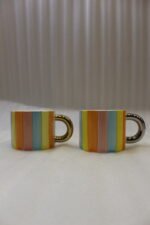 Colorful pastel vertical striped ceramic mug with a round gold metallic handle resting on a marble kitchen countertop.Colorful pastel vertical striped ceramic mug with a round gold metallic handle resting on a marble kitchen countertop.Colorful pastel vertical striped ceramic mug with a round gold metallic handle resting on a marble kitchen countertop.Colorful pastel vertical striped ceramic mug with a round gold metallic handle resting on a marble kitchen countertop.Colorful pastel vertical striped ceramic mug with a round gold metallic handle resting on a marble kitchen countertop.Colorful pastel vertical striped ceramic mug with a round gold metallic handle resting on a marble kitchen countertop.