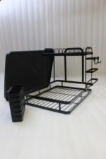Modern 2-tier black metal dish drying rack with side utensil caddy and bottom drain tray on a kitchen countertop.