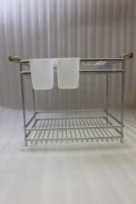 Two-tier silver dish drying rack with wooden side handles, hanging utensil holders, and a plastic drip tray on a kitchen countertop.