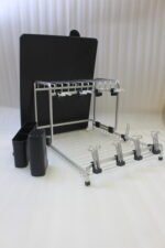 Modern 2-tier stainless steel dish drying rack with integrated knife block, utensil caddy, cup holders, and drainage tray on a granite countertop next to the sink.