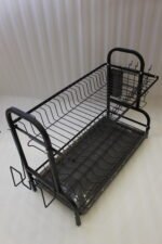 2-tier black metal dish drying rack with removable drain tray and side utensil holder on a kitchen countertop