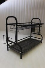 2-tier black metal dish drying rack with removable drain tray and side utensil holder on a kitchen countertop