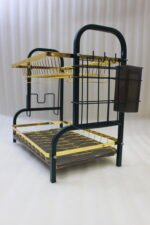 Two-tier gold and black metal dish drying rack with removable drip tray and utensil holder on a white marble kitchen countertop.