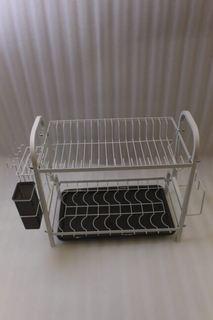 White 2-tier metal wire dish drying rack with removable dark gray drain tray and side utensil holder on a marble kitchen countertop.