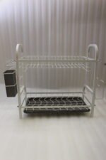 White 2-tier metal wire dish drying rack with removable dark gray drain tray and side utensil holder on a marble kitchen countertop.