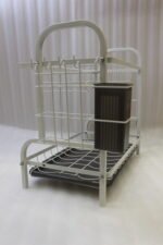 White 2-tier metal wire dish drying rack with removable dark gray drain tray and side utensil holder on a marble kitchen countertop.