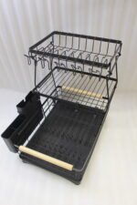 3-tier black wire dish drying rack on a marble countertop with wooden handles, attached utensil holder, and removable drip tray