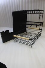 3-tier black wire dish drying rack on a marble countertop with wooden handles, attached utensil holder, and removable drip tray