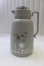 Two 2-liter MIXFF insulated thermal vacuum flasks in matte grey and beige with silver dandelion prints on a kitchen countertop.