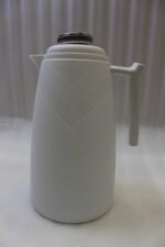 Three One More 1 Liter modern thermal vacuum flasks in charcoal grey, taupe beige, and white standing on a white kitchen marble countertop.