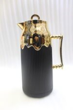 Three One More 1 Liter luxury thermal vacuum flasks in black, brown, and cream with fluted ribbed bodies, ornate gold handles, and gold crown topsThree One More 1 Liter luxury thermal vacuum flasks in black, brown, and cream with fluted ribbed bodies, ornate gold handles, and gold crown topsThree One More 1 Liter luxury thermal vacuum flasks in black, brown, and cream with fluted ribbed bodies, ornate gold handles, and gold crown tops on a marble kitchen counter.Three One More 1 Liter luxury thermal vacuum flasks in black, brown, and cream with fluted ribbed bodies, ornate gold handles, and gold crown tops on a marble kitchen counter.Three One More 1 Liter luxury thermal vacuum flasks in black, brown, and cream with fluted ribbed bodies, ornate gold handles, and gold crown tops on a marble kitchen counter.Three One More 1 Liter luxury thermal vacuum flasks in black, brown, and cream with fluted ribbed bodies, ornate gold handles, and gold crown tops on a marble kitchen counter.Three One More 1 Liter luxury thermal vacuum flasks in black, brown, and cream with fluted ribbed bodies, ornate gold handles, and gold crown tops on a marble kitchen counter.Three One More 1 Liter luxury thermal vacuum flasks in black, brown, and cream with fluted ribbed bodies, ornate gold handles, and gold crown tops on a marble kitchen counter.Three One More 1 Liter luxury thermal vacuum flasks in black, brown, and cream with fluted ribbed bodies, ornate gold handles, and gold crown tops on a marble kitchen counter. on a marble kitchen counter. on a marble kitchen counter.