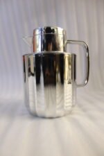 One More 1 Liter polished fluted stainless steel thermal vacuum flask on a marble kitchen countertop