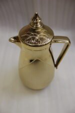 1-Liter metallic gold insulated vacuum flask with fluted ribbed design on a marble countertop
