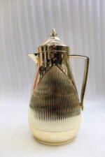 1-Liter metallic gold insulated vacuum flask with fluted ribbed design on a marble countertop