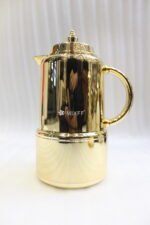 Polished metallic gold 1-liter thermal vacuum flask for coffee and tea displayed on a marble kitchen countertop