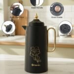 Black 1 litre Feenik thermal flask with gold floral design, glass inside, push-then-pour mechanism, and airtight cap displayed on a kitchen counter